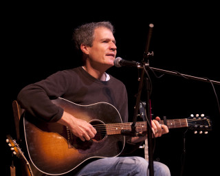 Musician Dave Ruch playing guitar