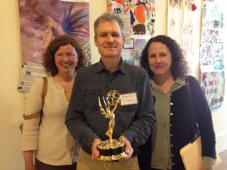 Dave Ruch holding New England Emmy Award for Adirondack Music project